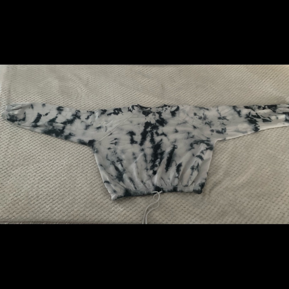 Lightly worn, blue and white tie dye shirt.